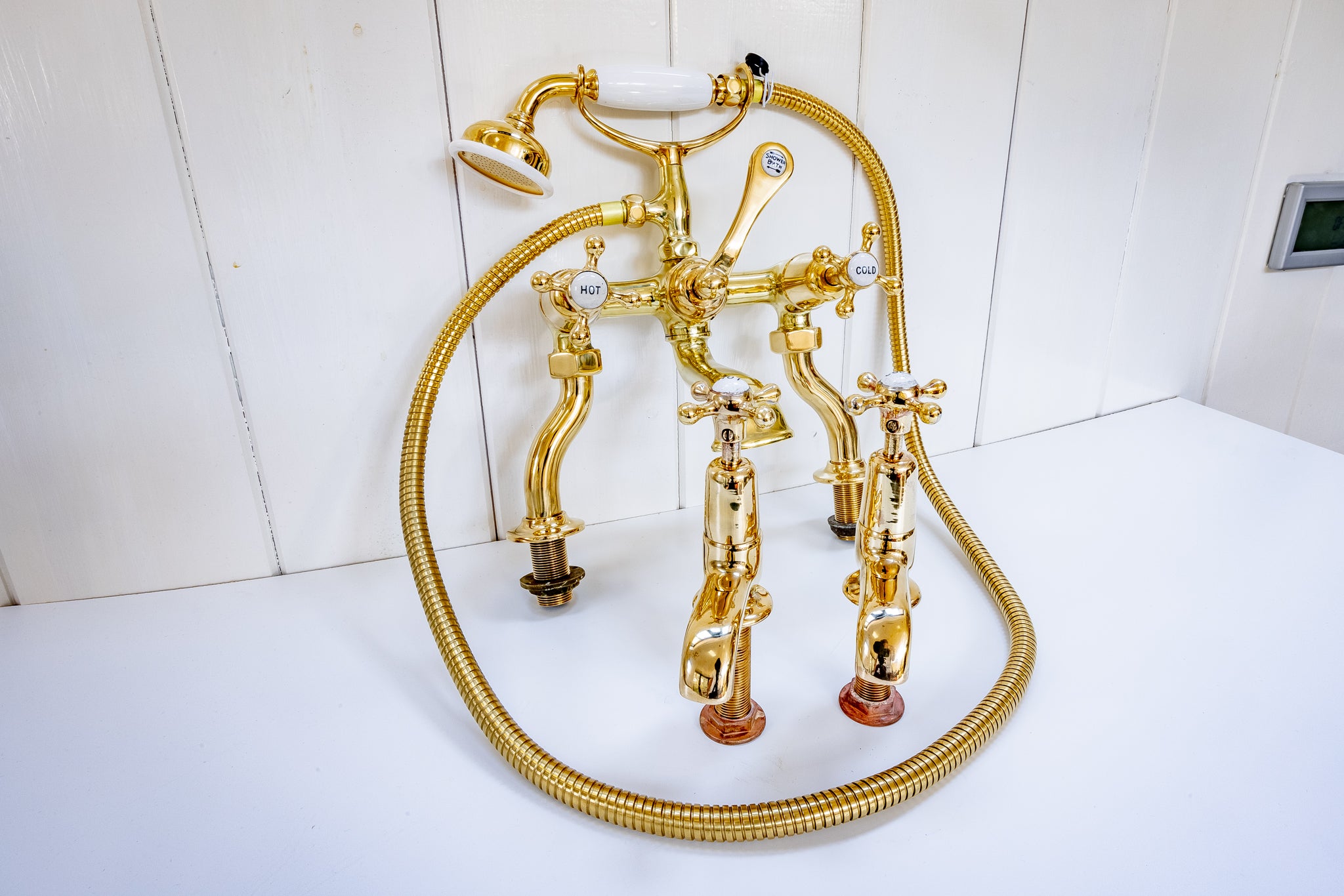 edwardian bath and basin matching tap set in un-lacquered polished brass c.1920