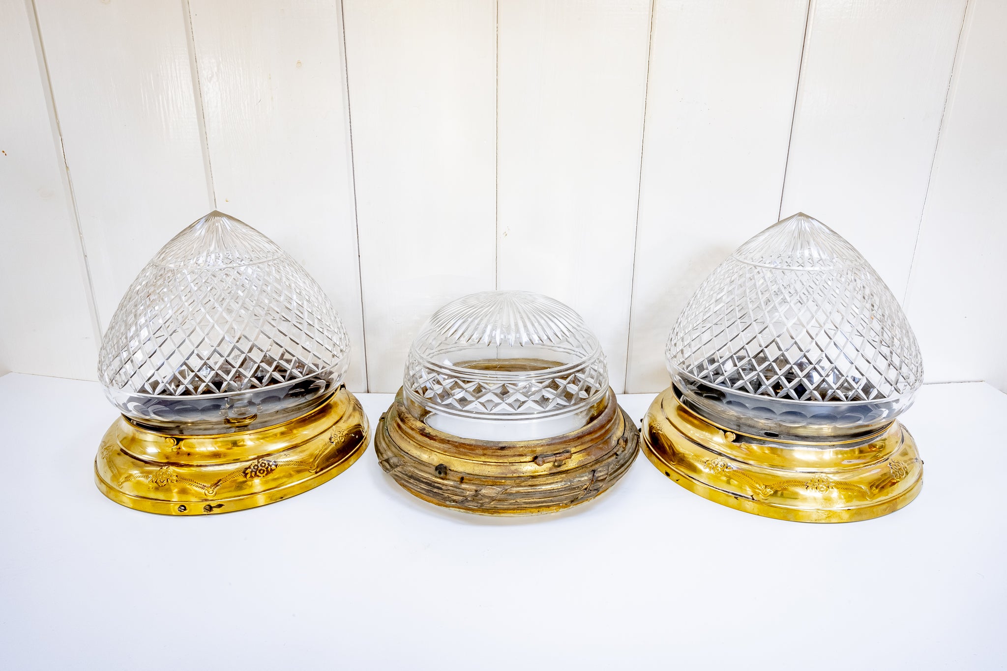 a pair of edwardian flush-mounted cut glass bathroom lights c.1920 and a single french cut chrystal lamp c.1920