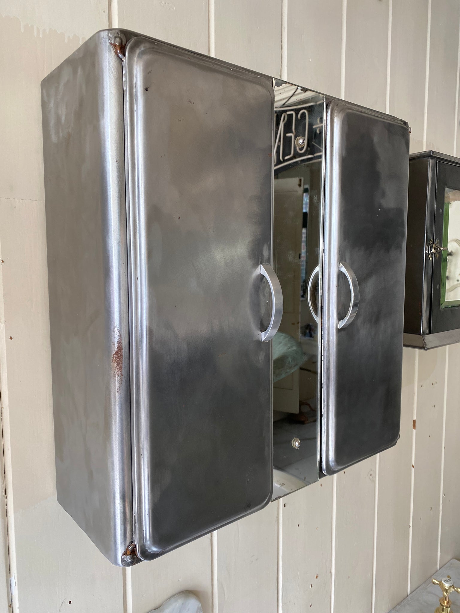 french polished metal bathroom cabinet with mirror and interior shelves c. 1950