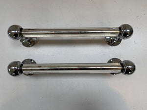 a peach glass towel rail and a pair of silver mirrored grab handles c.1920 silver