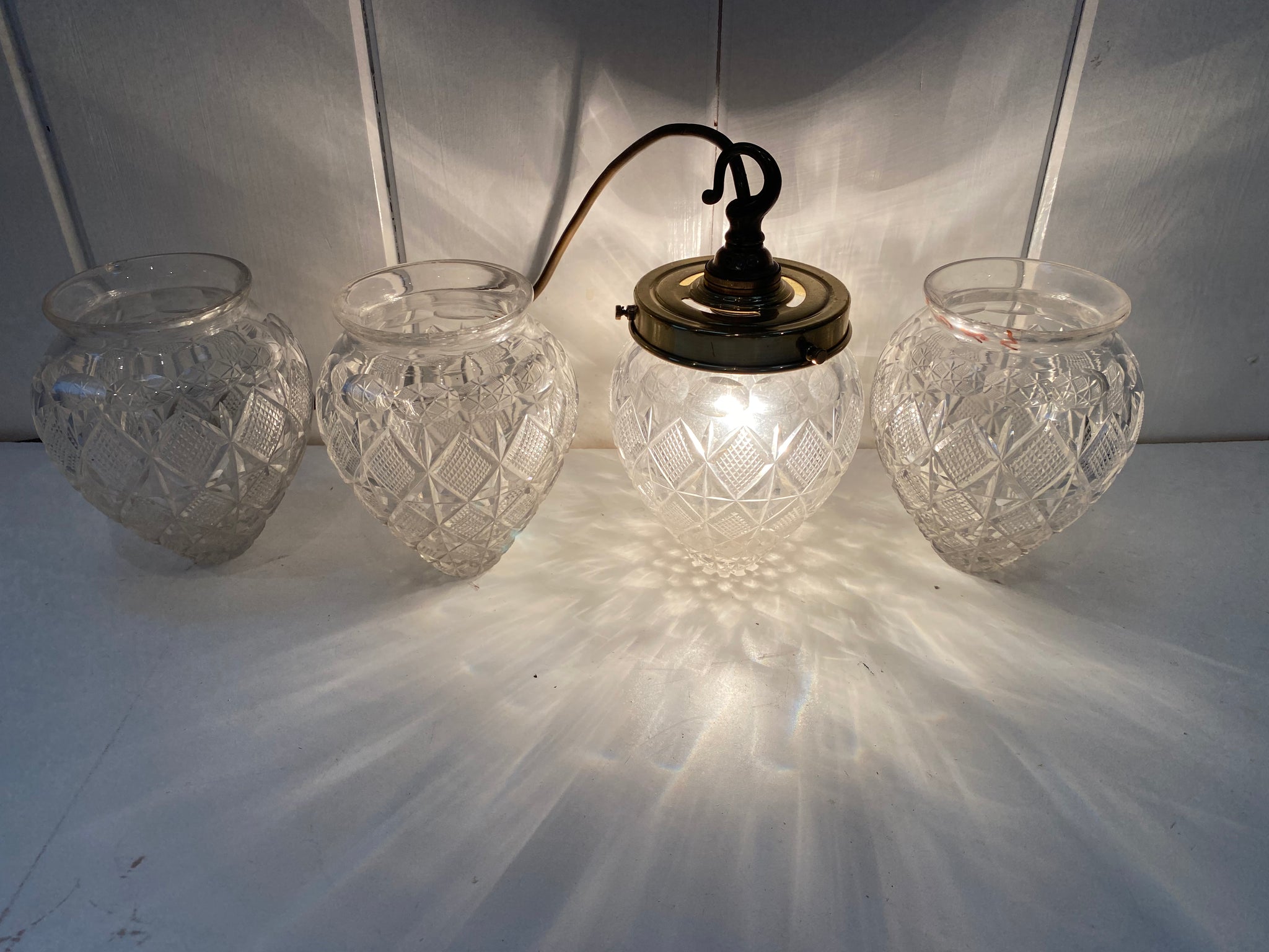 a set of four french cut crystal pineapple lampshades c.1900