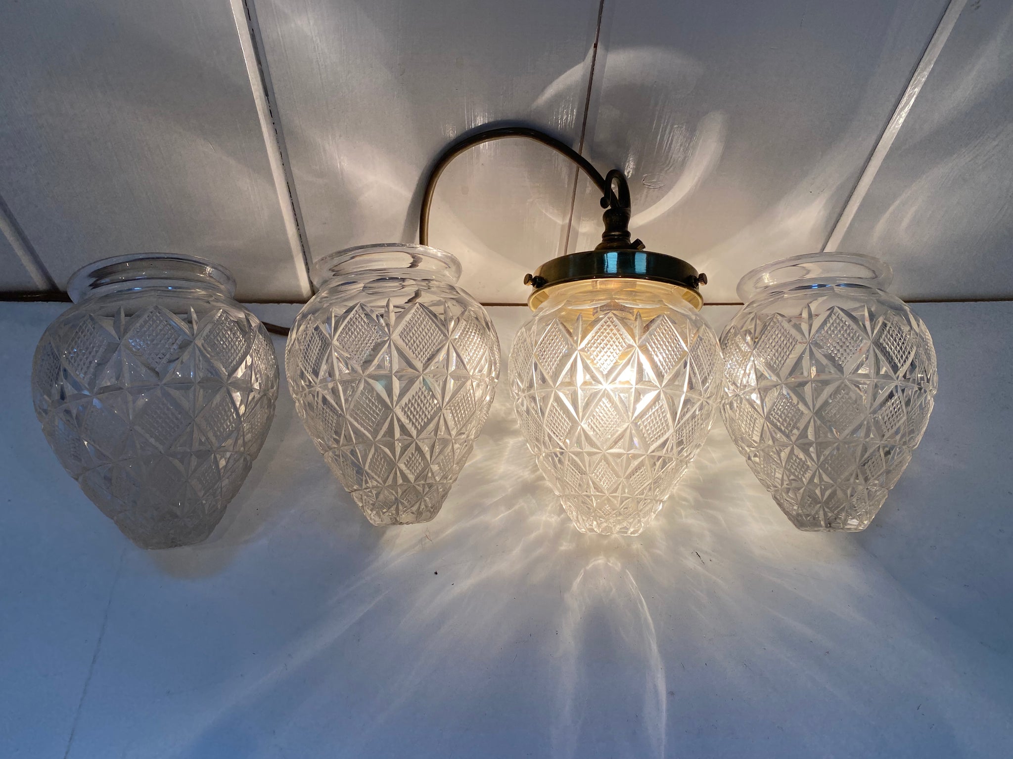 a set of four french cut crystal pineapple lampshades c.1900