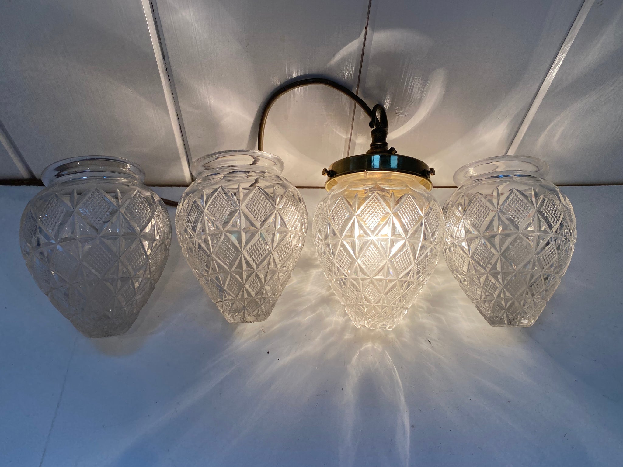 a set of four french cut crystal pineapple lampshades c.1900