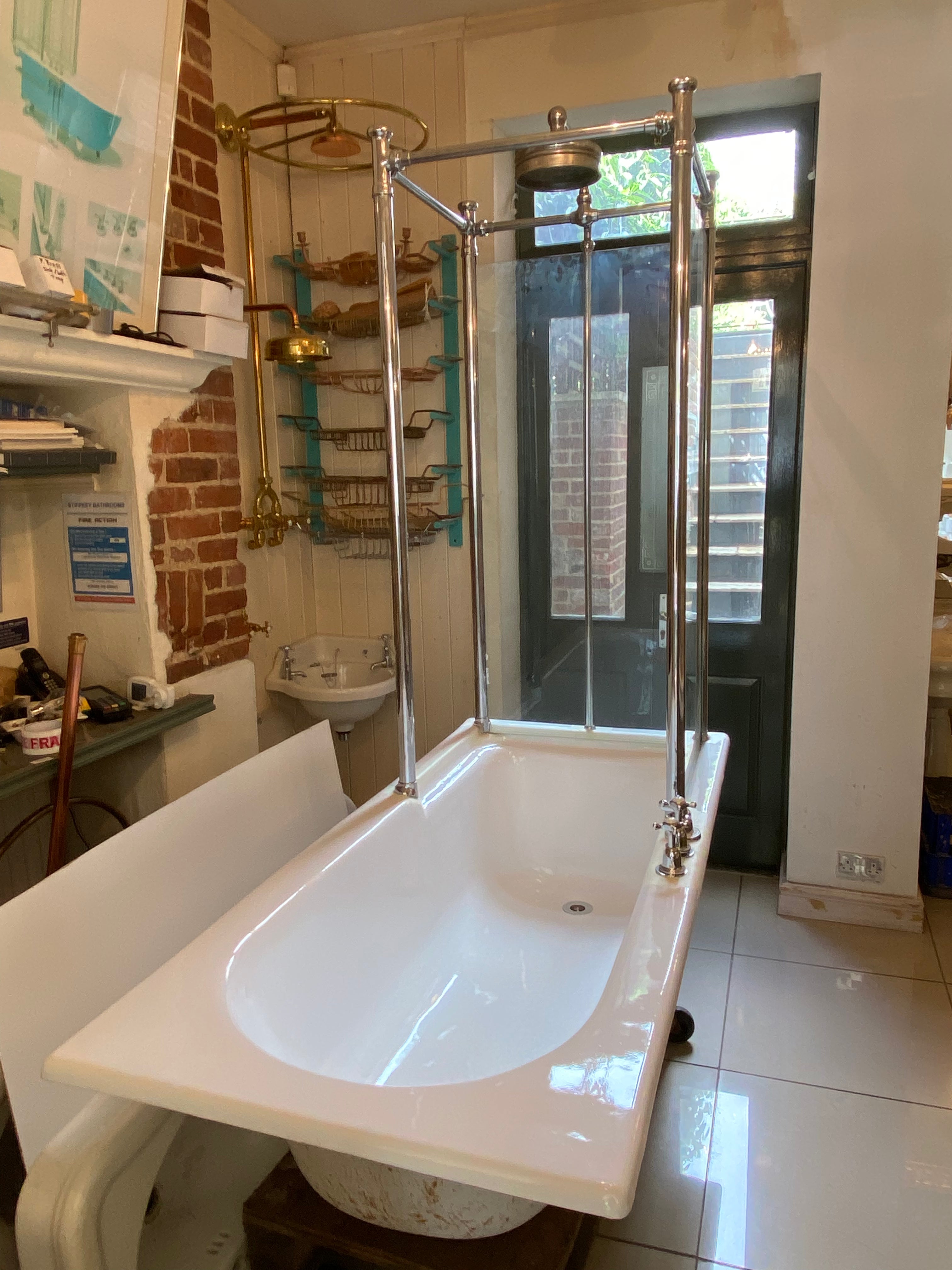 1930's cast iron shower bath with glass screens and chrome plated brassware