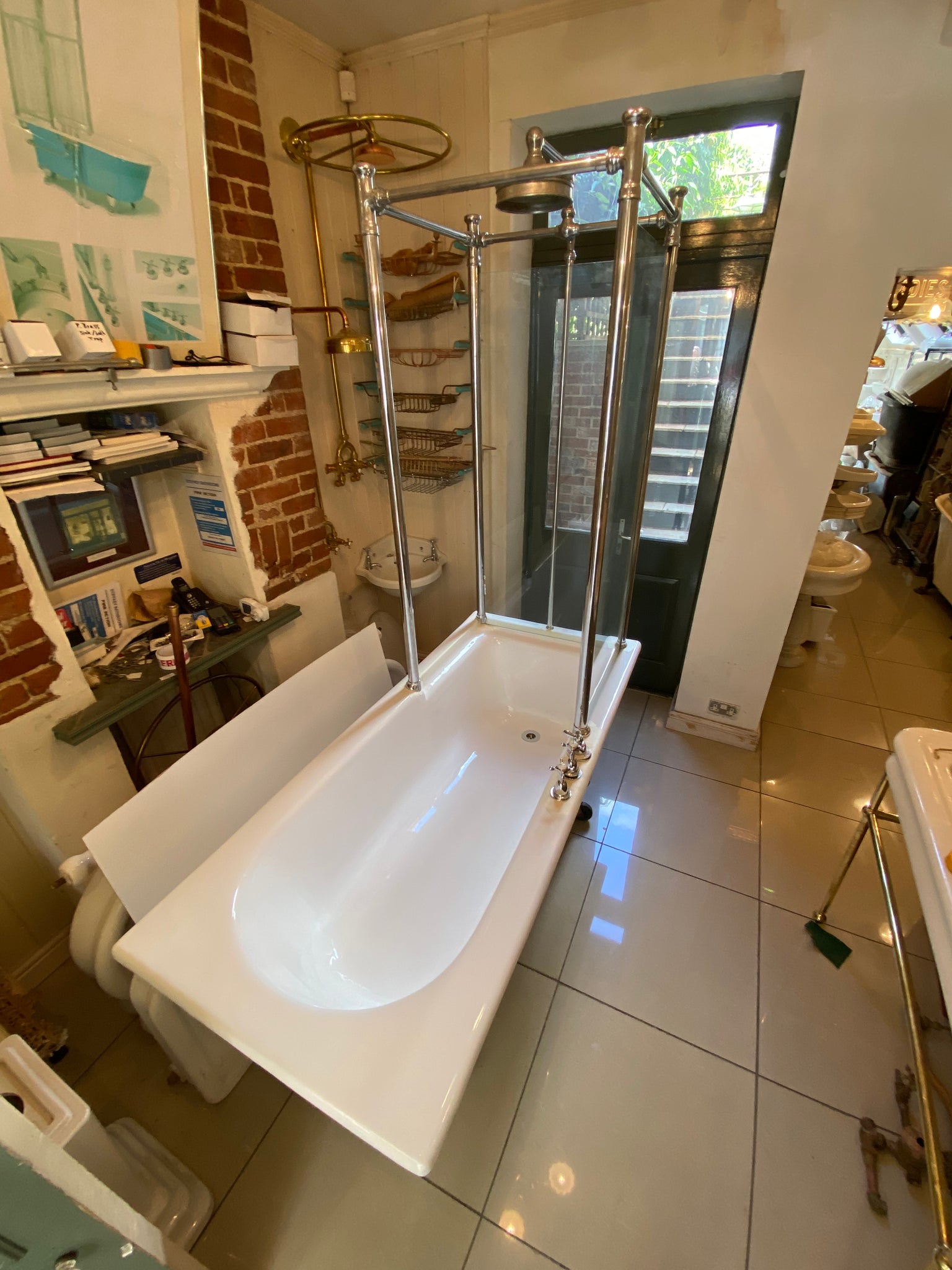 1930's cast iron shower bath with glass screens and chrome plated brassware