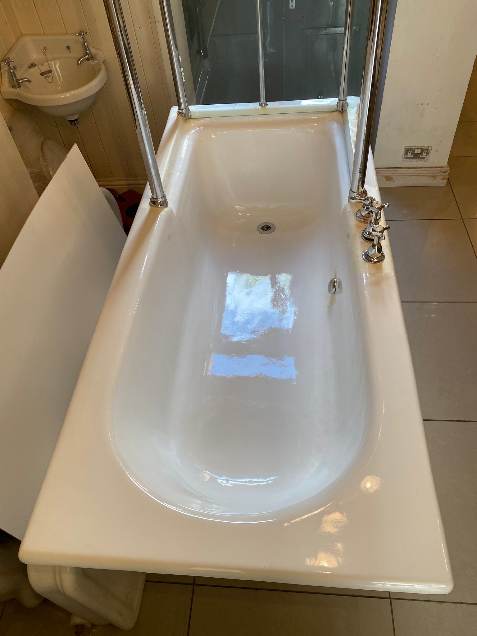 1930's cast iron shower bath with glass screens and chrome plated brassware