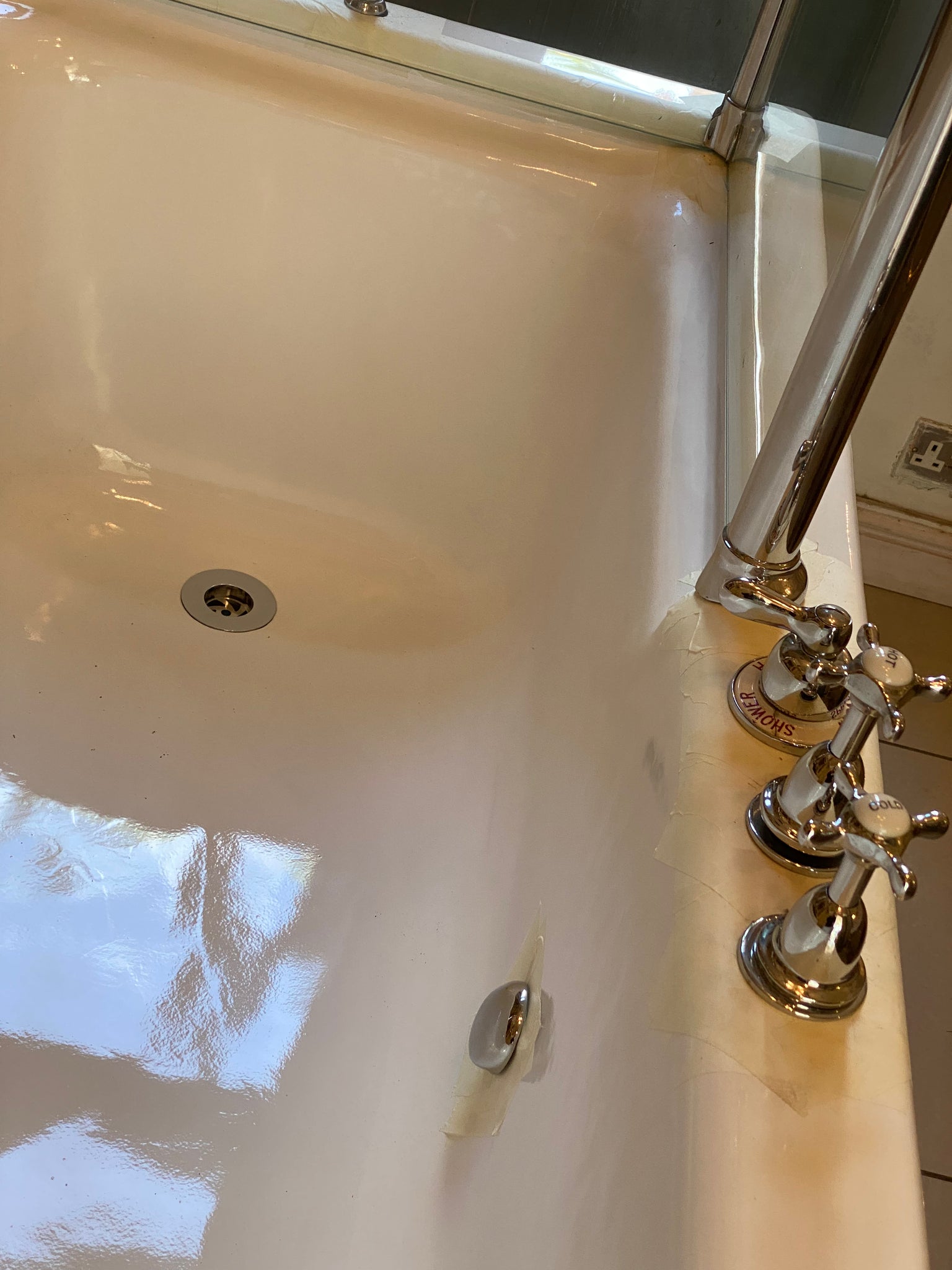 1930's cast iron shower bath with glass screens and chrome plated brassware