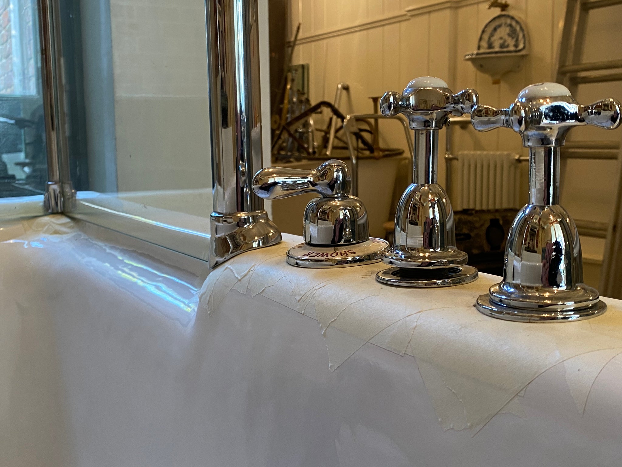 1930's cast iron shower bath with glass screens and chrome plated brassware
