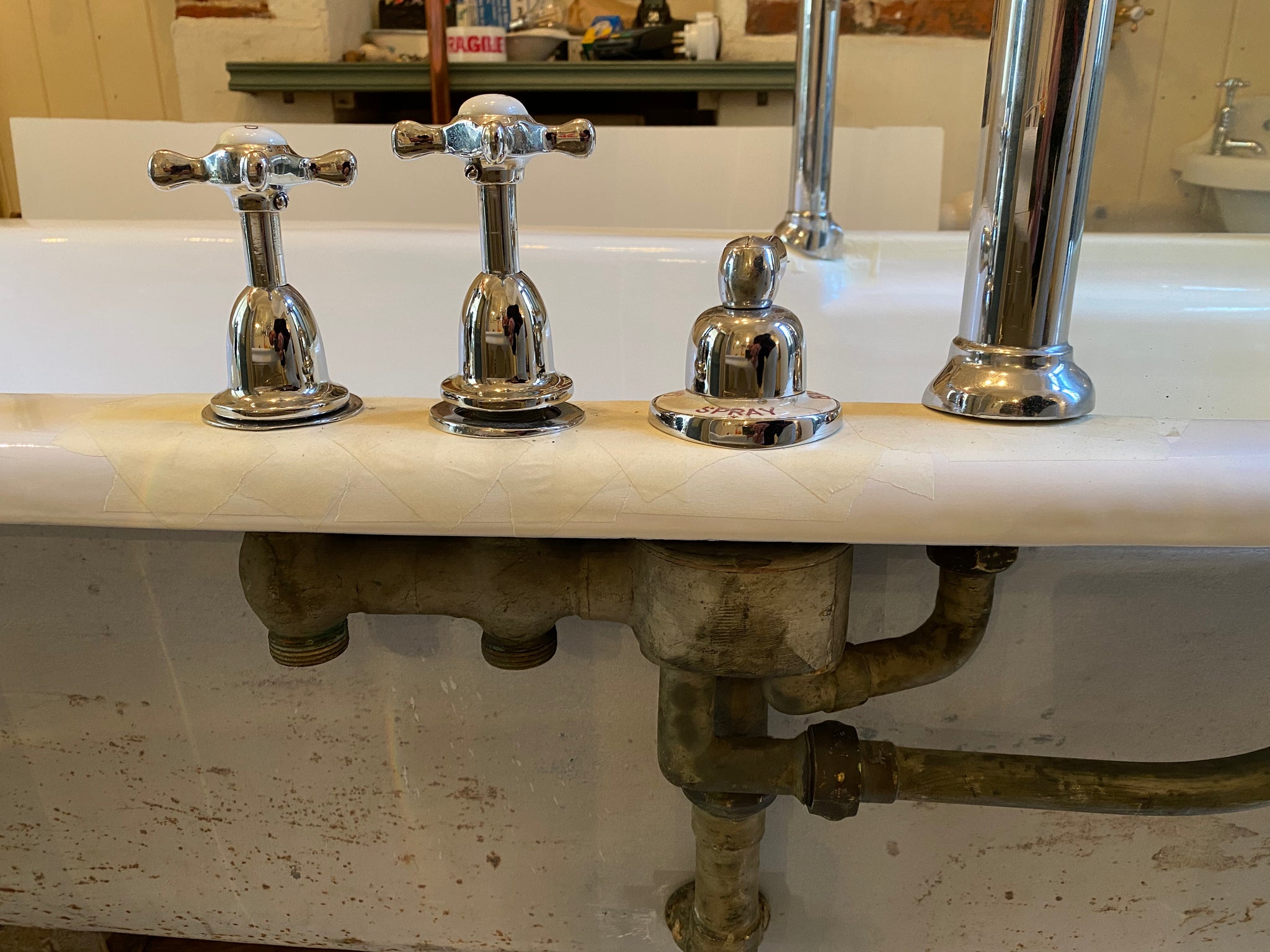 1930's cast iron shower bath with glass screens and chrome plated brassware