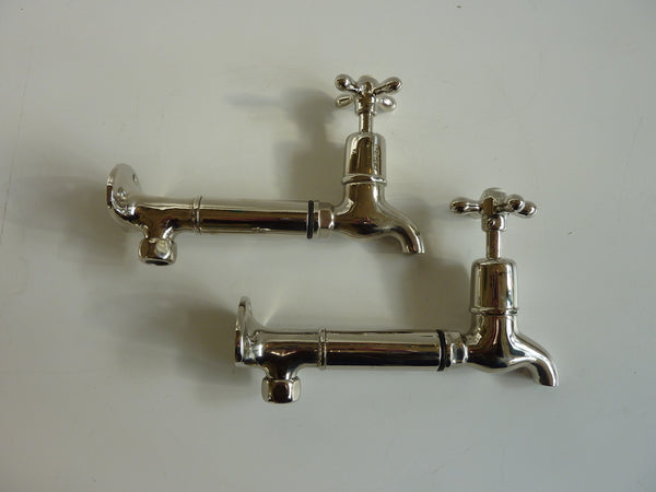 edwardian bib taps with extensions and original wall-mounts in polished nickel plate c.1920
